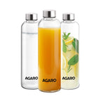 Set of three AGARO Borosilicate Glass Water Bottles (1000ml each) with stainless steel screw caps, displayed with water, orange juice, and lemon-infused water. Premium transparent glass bottles suitable for storing hot and cold beverages, featuring a leakproof and scratch-resistant design.
