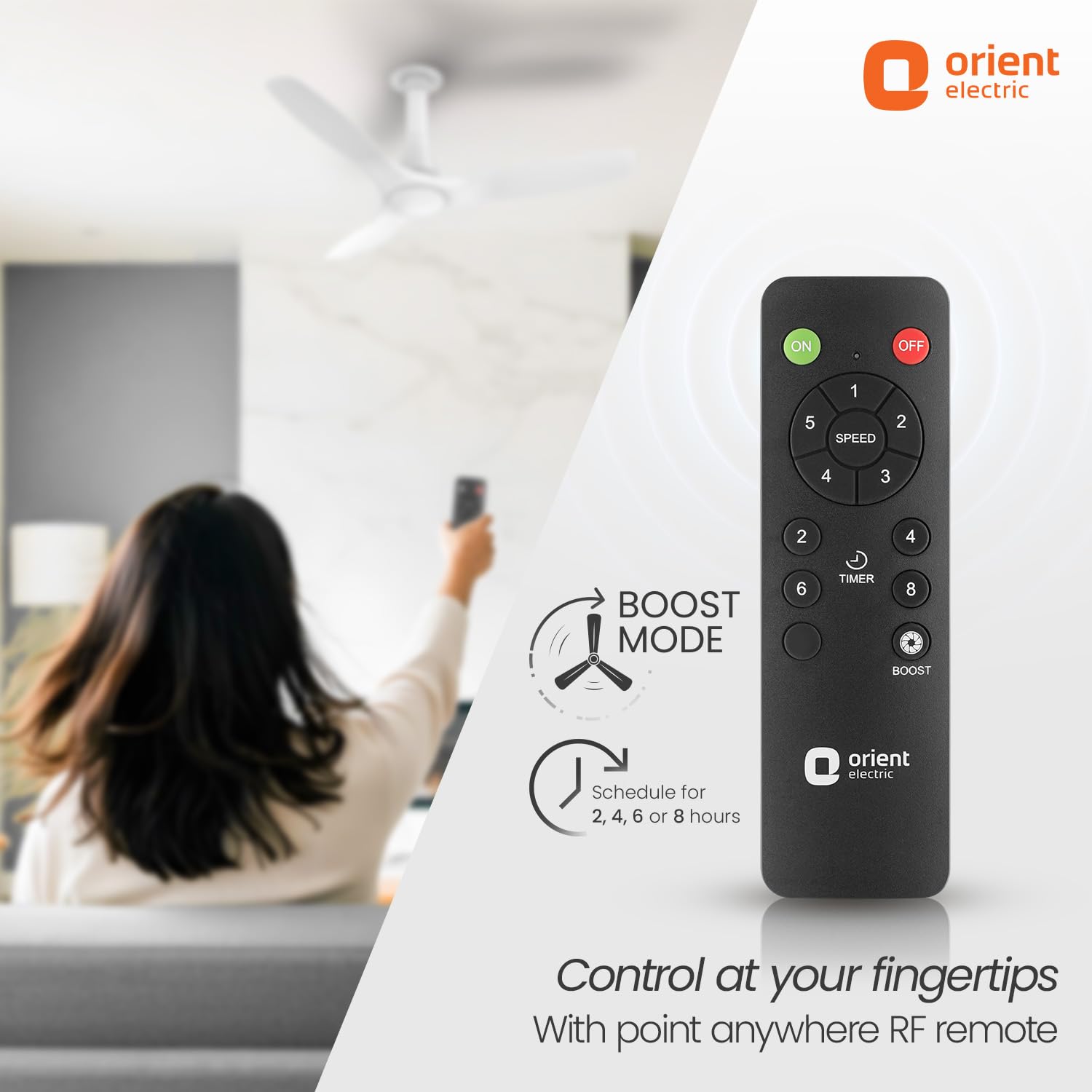 Orient Electric remote control with boost mode feature, woman using a remote in the background