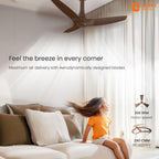 Ceiling fan in a room with a child sitting on a couch, promoting maximum air delivery.