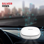 Honeywell air purifier on a car dashboard with 'Silver Ions' text above.