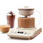 Wonderchef automatic tea maker with a digital touch control panel and transparent glass kettle, preparing masala chai. The image also features a glass of hot tea and a creamy iced chocolate drink, highlighting its versatility for making tea, cappuccino, and hot beverages at home.