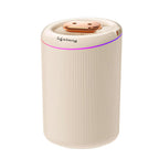 Portable USB Type-C cool mist humidifier in ivory white with a ribbed cylindrical design, rose gold top cover, and colorful LED ambient light ring. Ideal for bedrooms, offices, cars, and desktops to add moisture and improve indoor air quality.