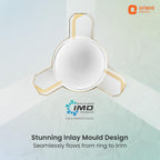 A ceiling fan blade inlay design by Orient Electric, showcasing a seamless white circular inlay with gold trim extending to the three blade tips. The graphic includes branding for Orient Electric and IMD Technology, along with descriptive text about the seamless inlay design.