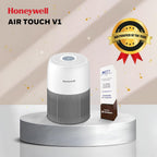 Honeywell Air Touch V1 air purifier on a white platform with an award on a beige background