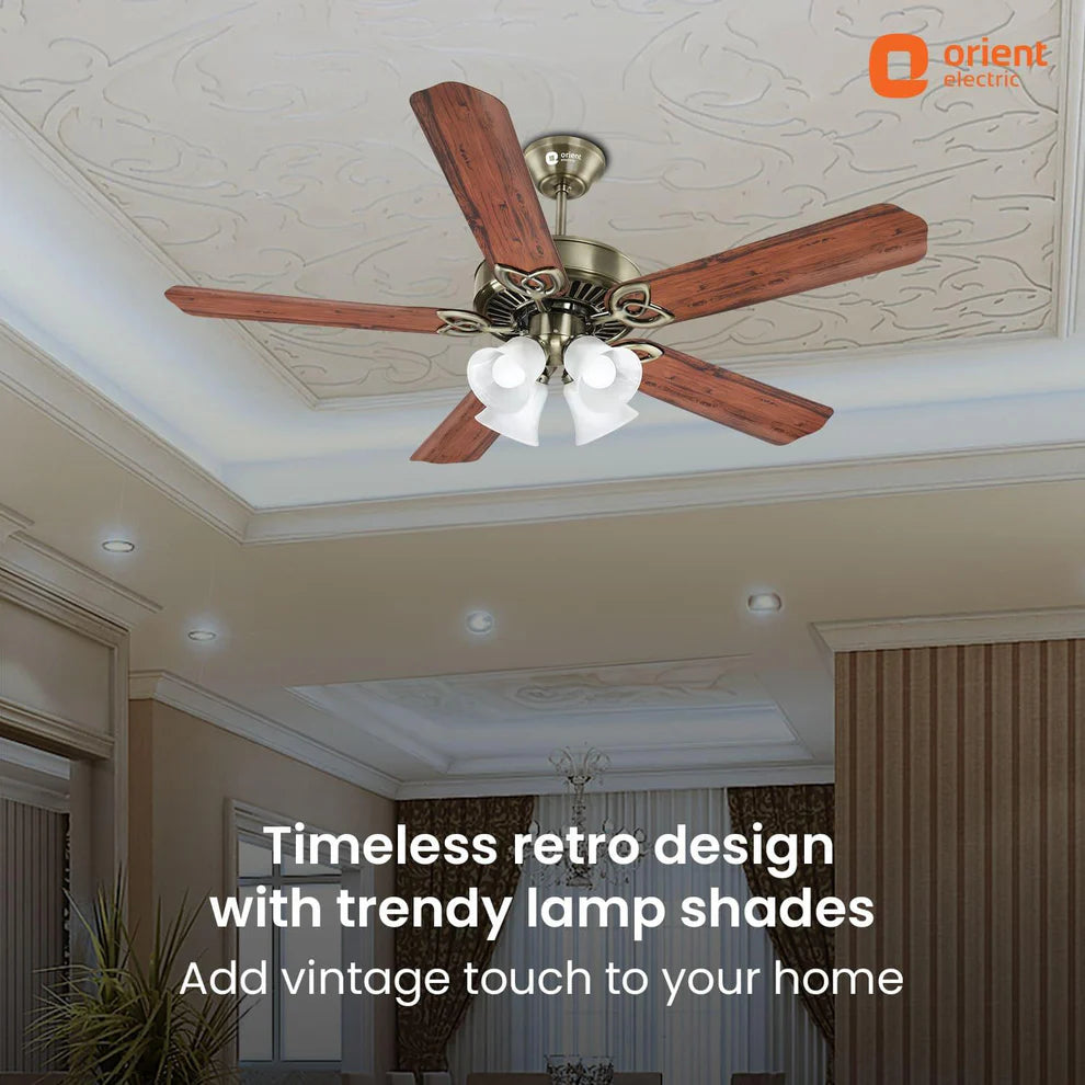 Ceiling fan with wooden blades and white lamp shades in a room with decorative ceiling and curtains.