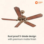 A 5-blade ceiling fan with dark brown wooden blades and a bronze-finished central motor housing, shown against a light beige background with promotional text and the Orient Electric logo.
