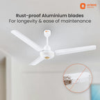White three-blade ceiling fan with text reading 'Rust-proof Aluminium blades For longevity & ease of maintenance' and an orange Orient Electric logo, shown installed on a ceiling with a small inset circle highlighting rust protection.