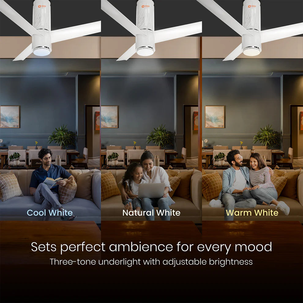 Ceiling fan with three different light color options in a living room setting.