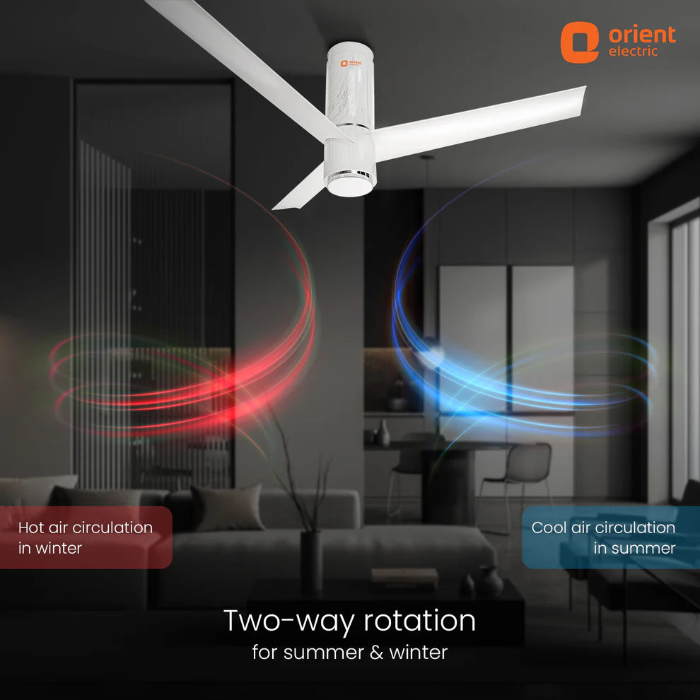 Ceiling fan with two-way rotation feature in a living room setting, featuring Orient Electric logo.