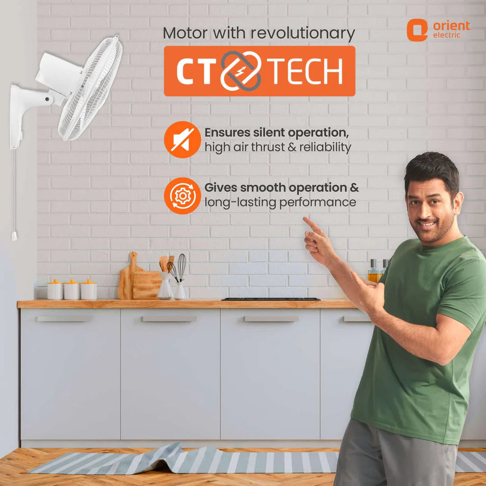 Person pointing at a wall-mounted fan with CT Tech features highlighted, set against a kitchen background.
