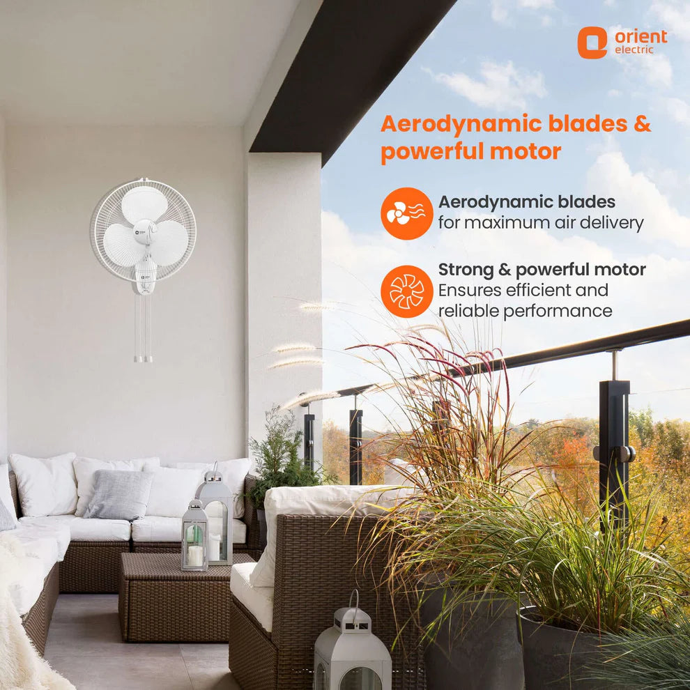 A white wall-mounted centrifugal fan with aerodynamic blades, shown installed on a modern outdoor balcony with lounge furniture, plants, and promotional text overlays from Orient Electric.