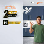Advertisement for Orient Electric with a man in a kitchen and warranty information.